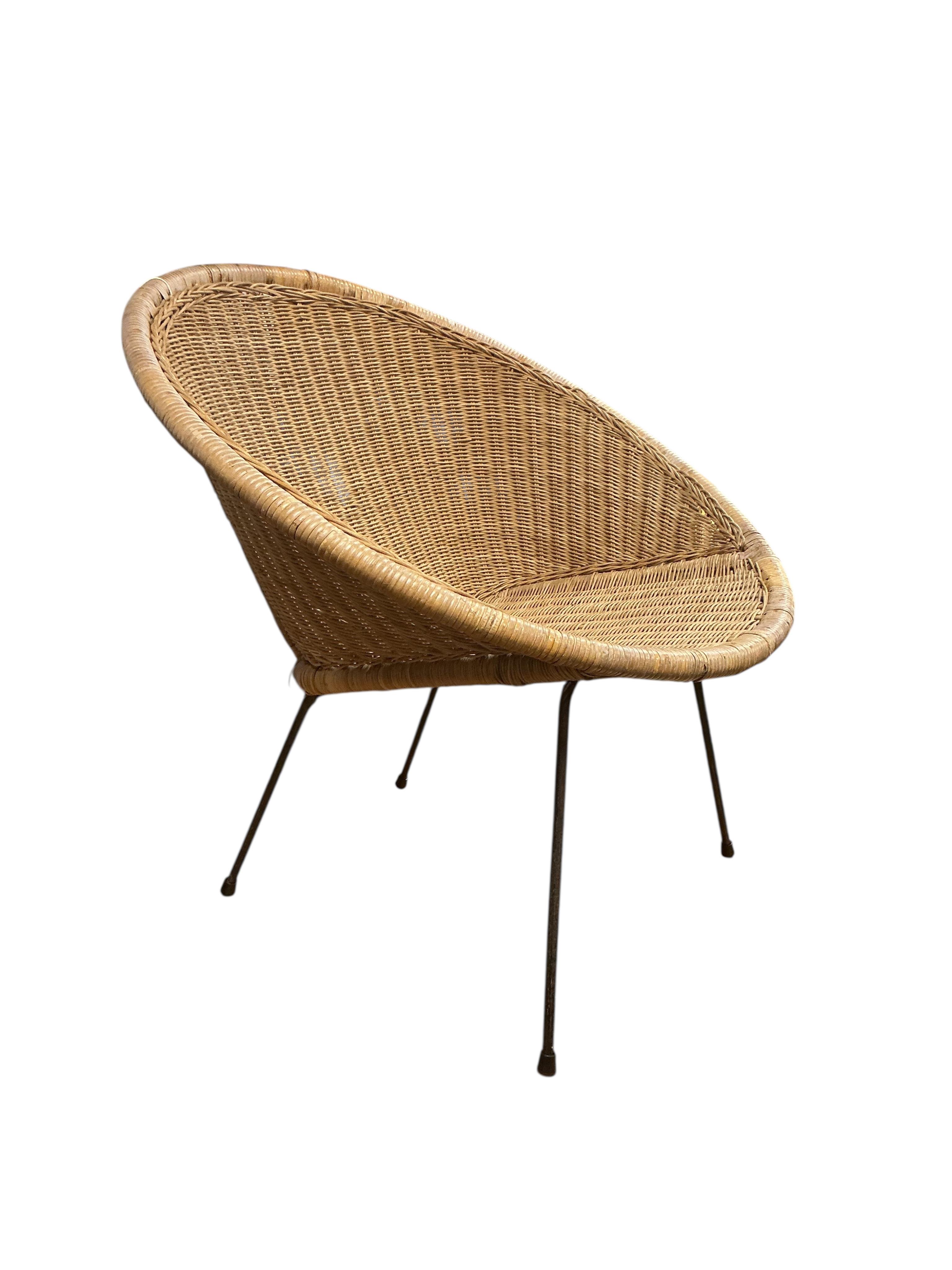 A mid century cane chair, width 74cm, height 73cm